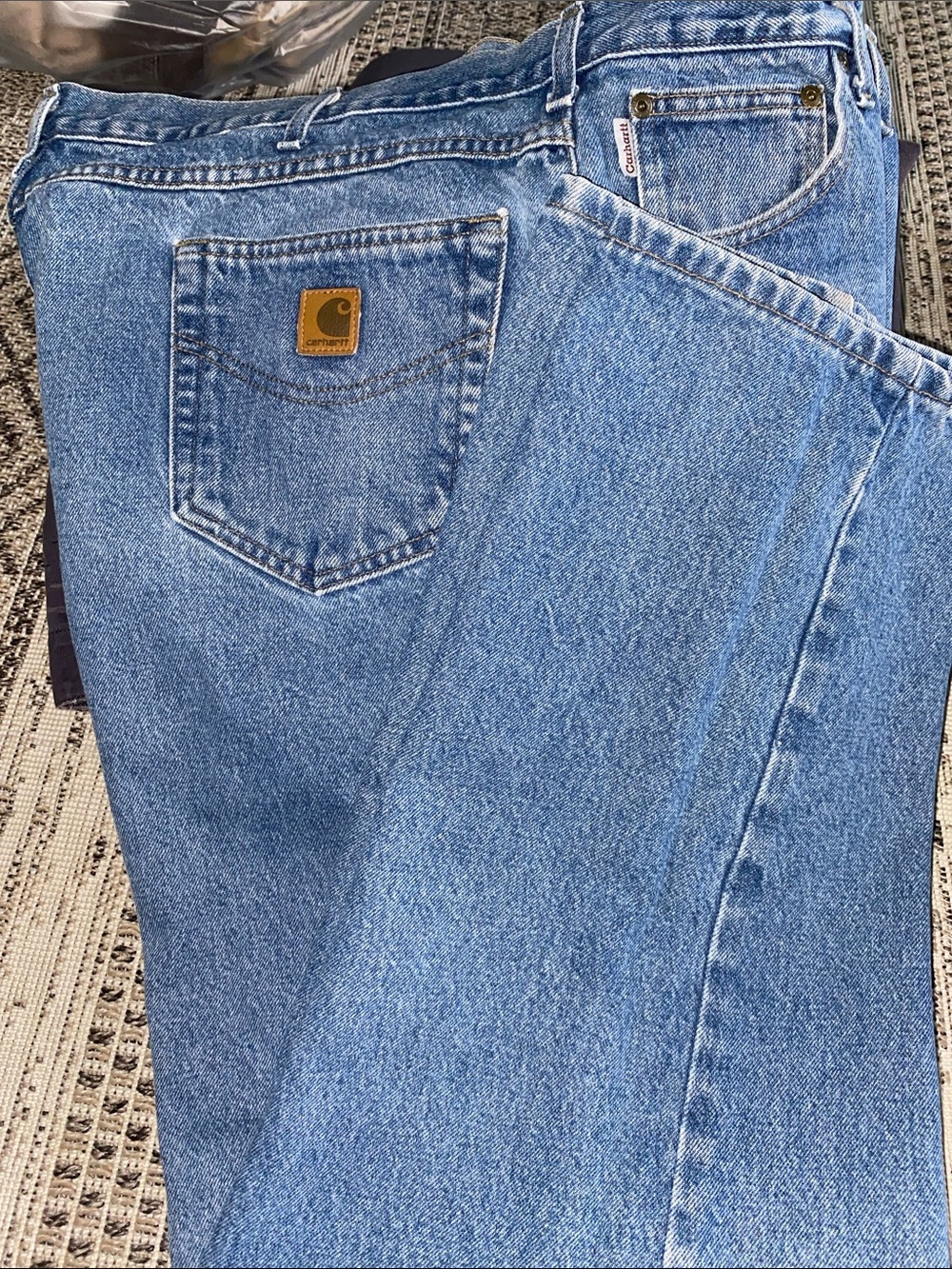 Carhartt Men’s relaxed fit straight leg jeans in a light blue denim wash 46x32